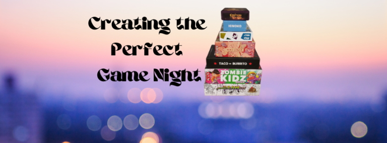 A stack of board games in front of a picture of an out of focus sunset.