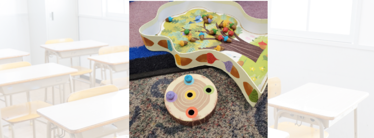 An Image of the kid friendly board game Sneaky Snacky Squirrel set up on the floor of a classroom.